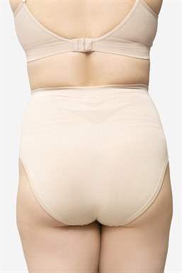 Soft nude maternity panties made of bamboo fibres - on pregnant body seen from behind