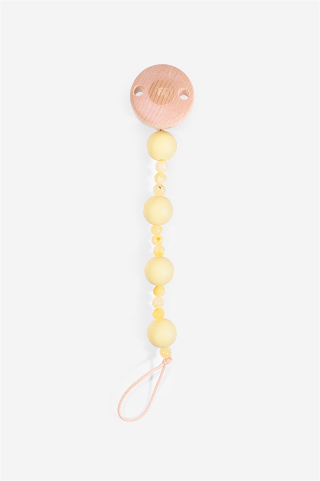 Pacifier cord with yellow beads and silicon beads - seen horisontal 