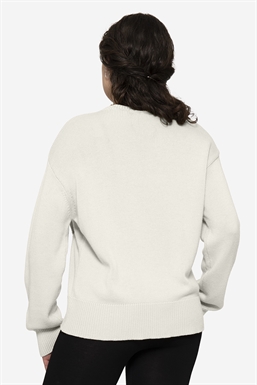 Loose breastfeeding-friendly jumper of plain knit in merino wool - seen from behind