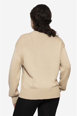 Loose breastfeeding-friendly jumper of plain knit in merino wool - seen from behind